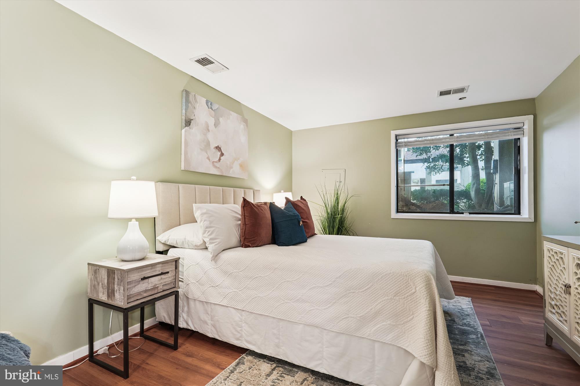 9731 Hellingly Place, Unit 37 Montgomery Village, MD 20886 - Photo 13 of 20 a bedroom with a bed and a window