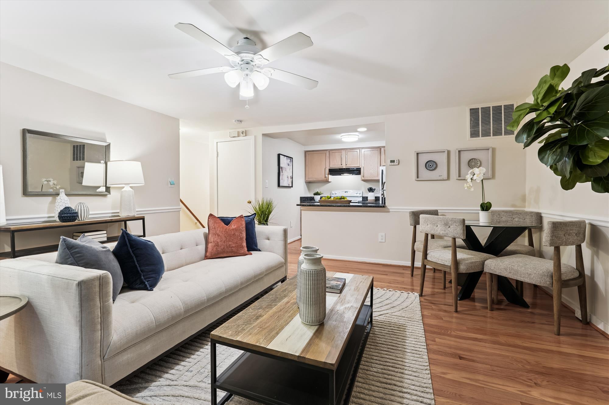 9731 Hellingly Place, Unit 37 Montgomery Village, MD 20886 - Photo 2 of 20 a living room with furniture and wooden floor
