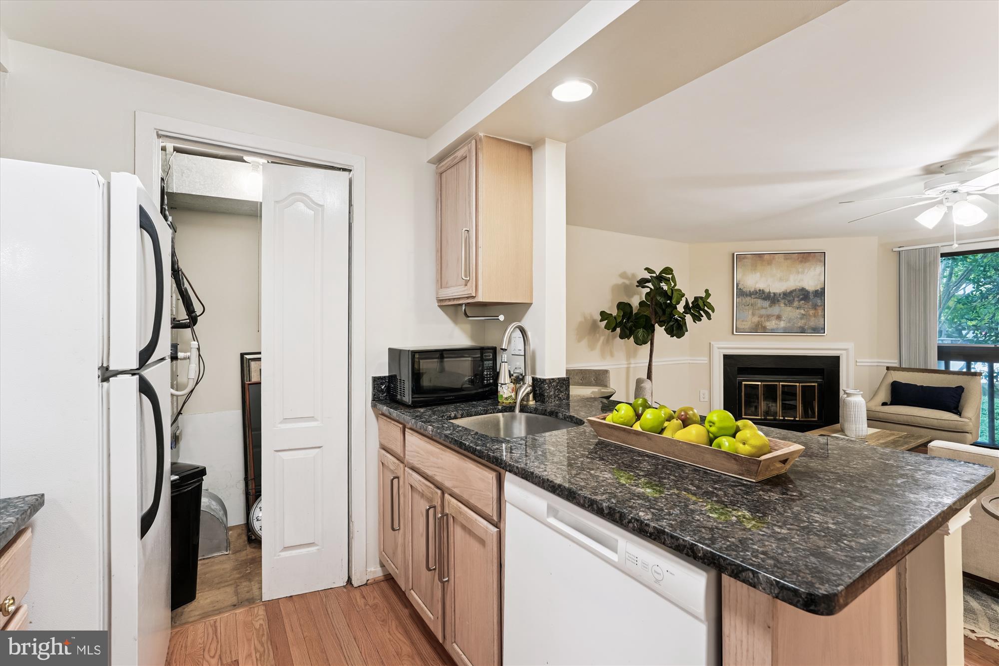 9731 Hellingly Place, Unit 37 Montgomery Village, MD 20886 - Photo 9 of 20 a kitchen with sink refrigerator and stove