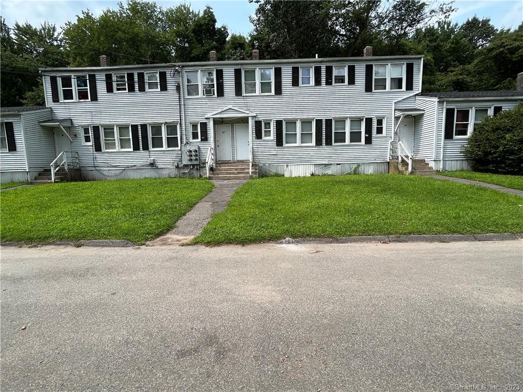 119 Proctor Street, Unit 119 Waterbury, CT 06706 - Photo 1 of 1 a front view of a house with a yard and potted plants
