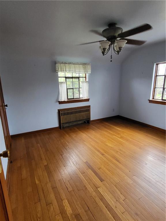 1003 Maple Avenue Turtle Creek, PA 15145 - Photo 12 of 24 wooden floor in an empty room with a window