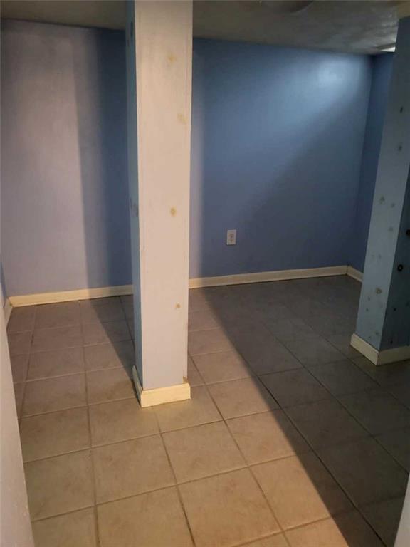 1003 Maple Avenue Turtle Creek, PA 15145 - Photo 17 of 24 an empty room with wooden floor
