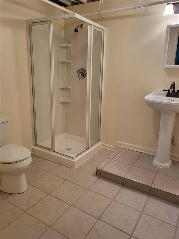 1003 Maple Avenue Turtle Creek, PA 15145 - Photo 18 of 24 a bathroom with a toilet and a shower