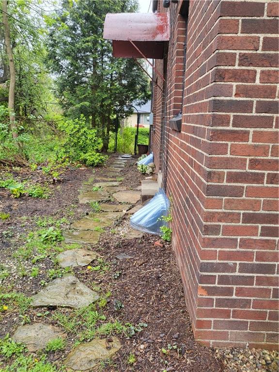 1003 Maple Avenue Turtle Creek, PA 15145 - Photo 21 of 24 a view of a pathway with a house