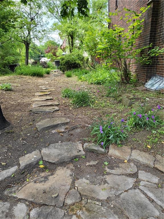 1003 Maple Avenue Turtle Creek, PA 15145 - Photo 22 of 24 a view of a road with a yard