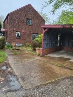 1003 Maple Avenue Turtle Creek, PA 15145 - Photo 23 of 24 a front view of a house with a yard