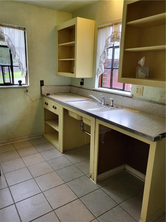 1003 Maple Avenue Turtle Creek, PA 15145 - Photo 8 of 24 a kitchen with a sink and a stove top oven