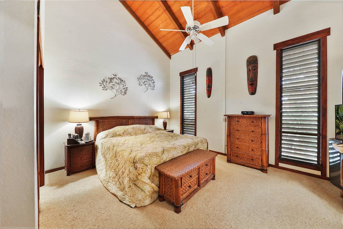 2721 Poipu Road, Unit 133 Koloa, HI 96756 - Photo 11 of 18 a spacious bedroom with a bed and a cabinets