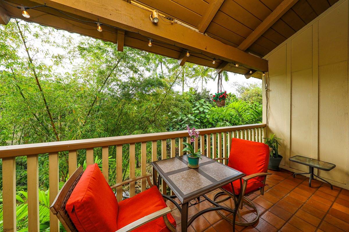 2721 Poipu Road, Unit 133 Koloa, HI 96756 - Photo 13 of 18 a balcony with wooden floor outdoor seating and yard in the back