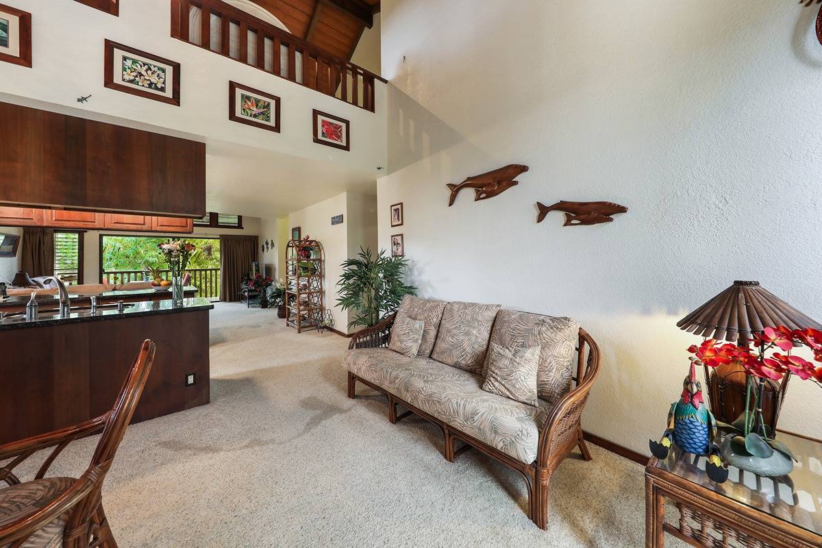 2721 Poipu Road, Unit 133 Koloa, HI 96756 - Photo 2 of 18 a living room with furniture and a flat screen tv
