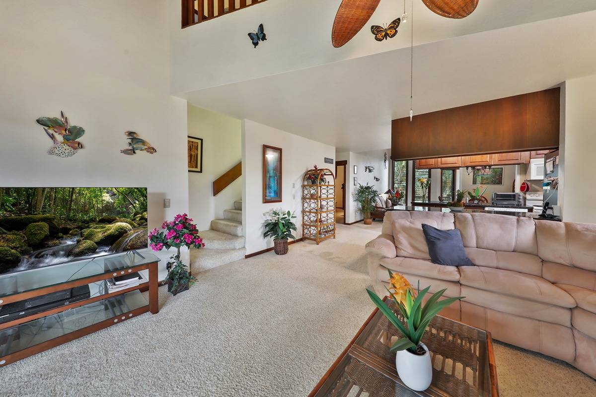 2721 Poipu Road, Unit 133 Koloa, HI 96756 - Photo 8 of 18 a living room with furniture and a flat screen tv