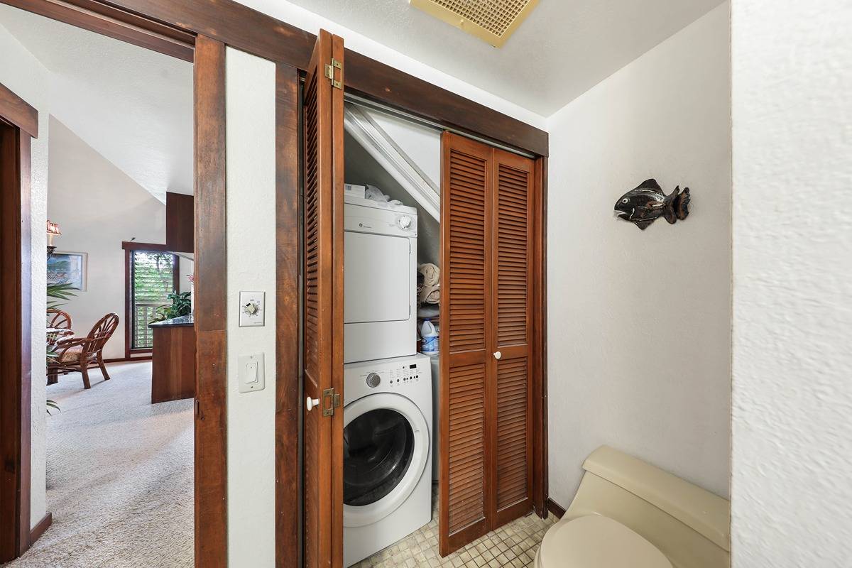 2721 Poipu Road, Unit 133 Koloa, HI 96756 - Photo 10 of 18 a view of a hallway with washer and dryer