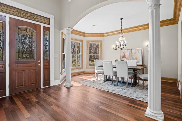 a view of a dining room with furniture window and wooden floor