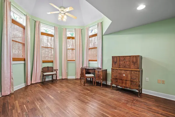 a living room with furniture and large windows