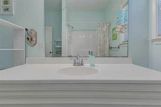 a bathroom with a sink toilet and vanity