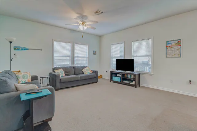 a kitchen with kitchen island granite countertop wooden cabinets a dining table and chairs