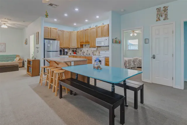 a view of a dining room with furniture