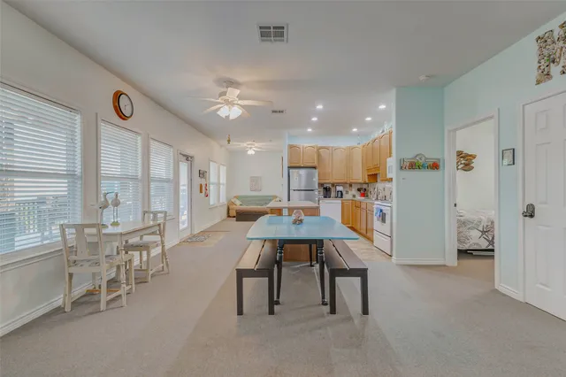 a kitchen with a sink a stove and refrigerator