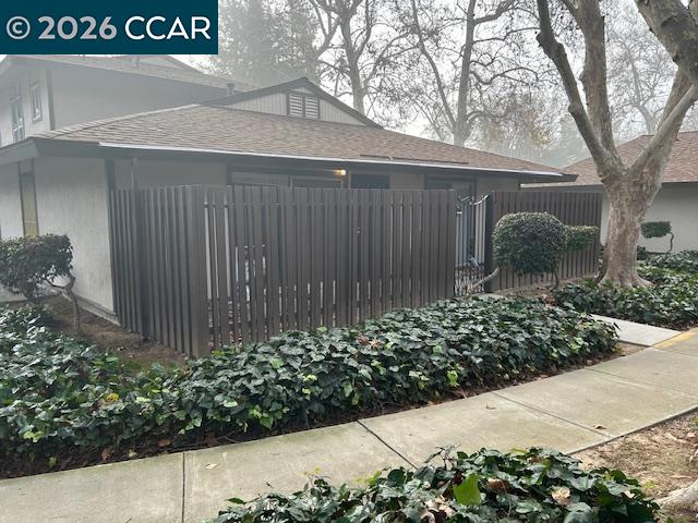 5451 Roundtree Place, Unit F Concord, CA 94521 - Photo 18 of 19 a front view of a house