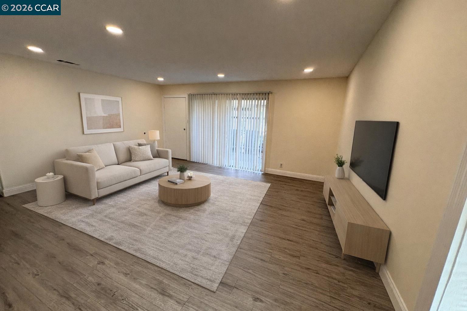 5451 Roundtree Place, Unit F Concord, CA 94521 - Photo 2 of 19 a living room with furniture and a flat screen tv