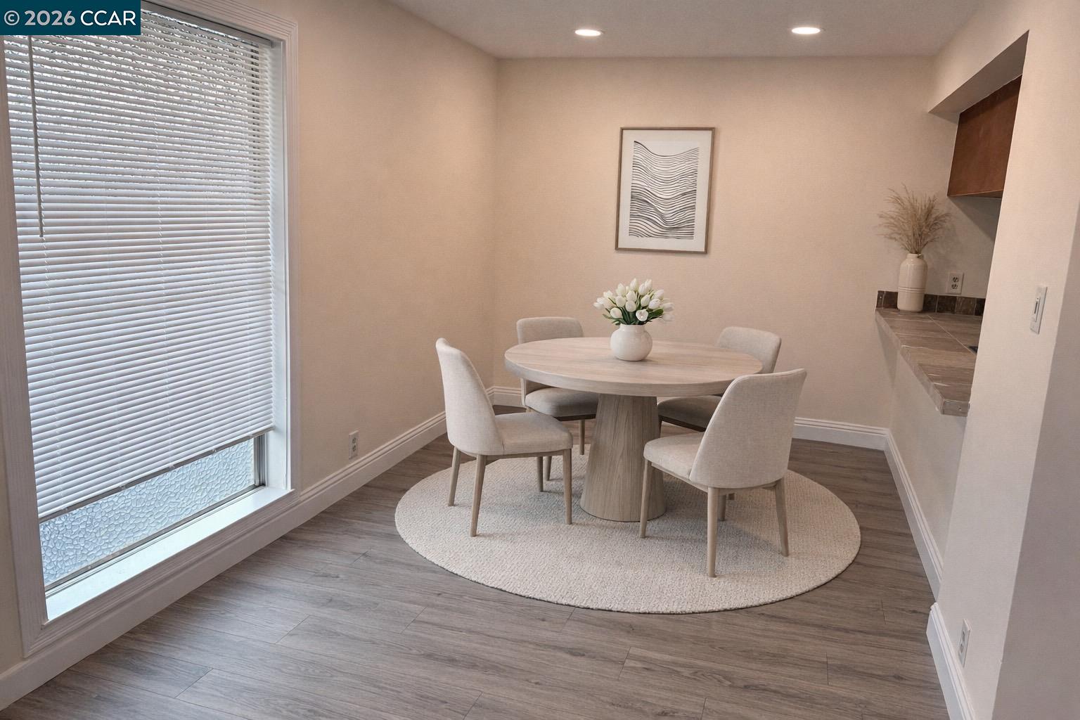 5451 Roundtree Place, Unit F Concord, CA 94521 - Photo 3 of 19 a view of a dining room with furniture and wooden floor