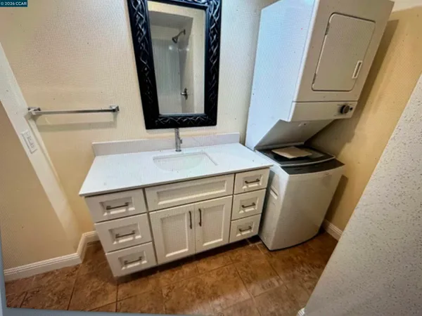 a bathroom with a sink and mirror