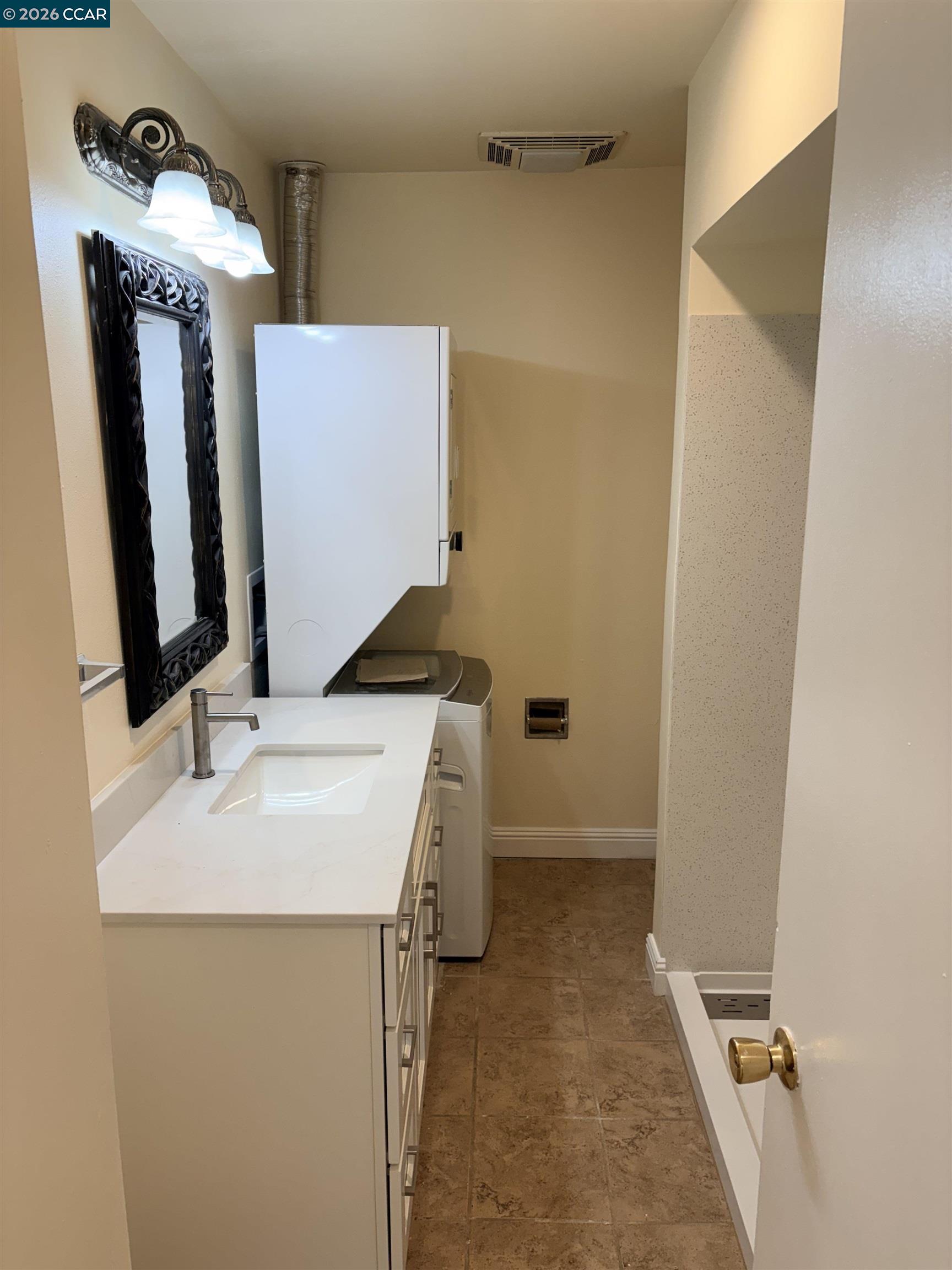 5451 Roundtree Place, Unit F Concord, CA 94521 - Photo 9 of 19 a bathroom with a sink and mirror
