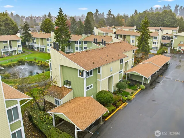 an aerial view of a house with garden space and street view