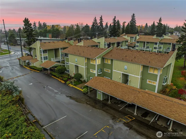 a aerial view of a house with a garden and a sitting area