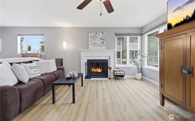 a living room with furniture and a fireplace