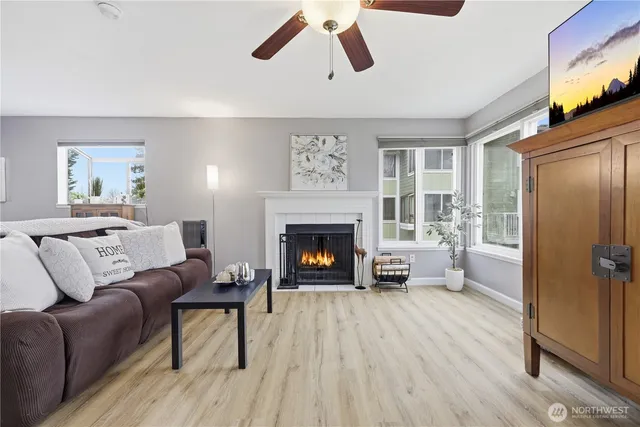 a living room with furniture and a fireplace