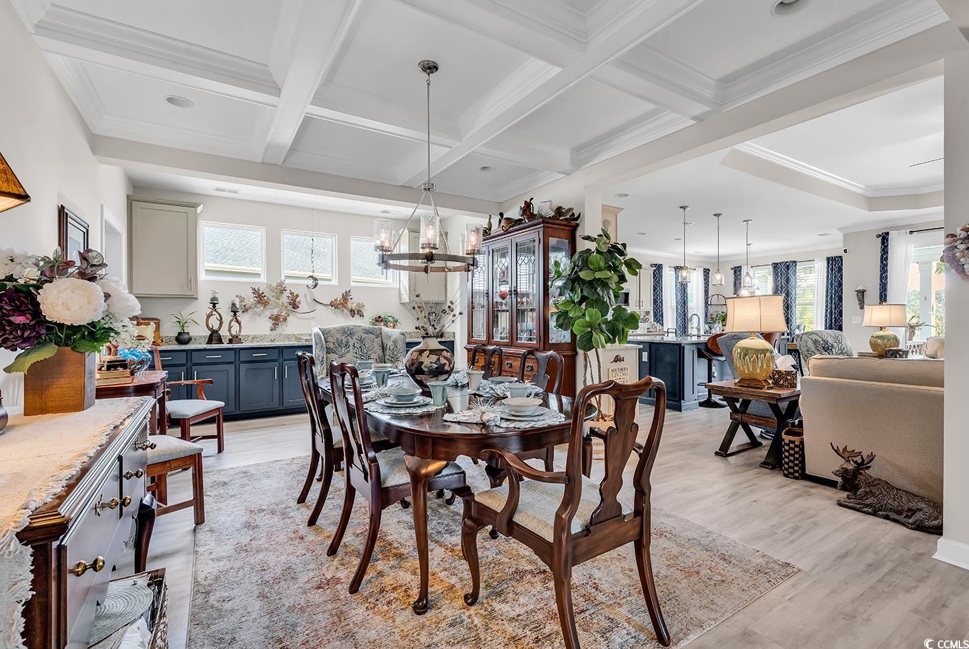 296 Switchgrass Loop Little River, SC 29566 - Photo 11 of 40 Dining room with light wood-style flooring, an inv