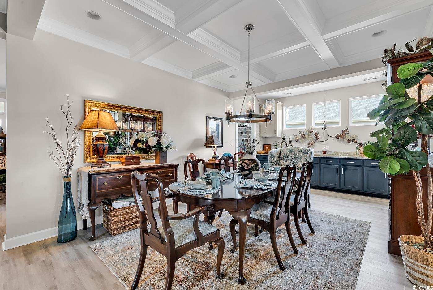 296 Switchgrass Loop Little River, SC 29566 - Photo 12 of 40 Dining room featuring a notable chandelier, light