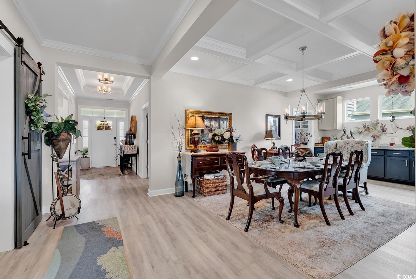 296 Switchgrass Loop Little River, SC 29566 - Photo 13 of 40 Dining space with light wood-style floors, a notab