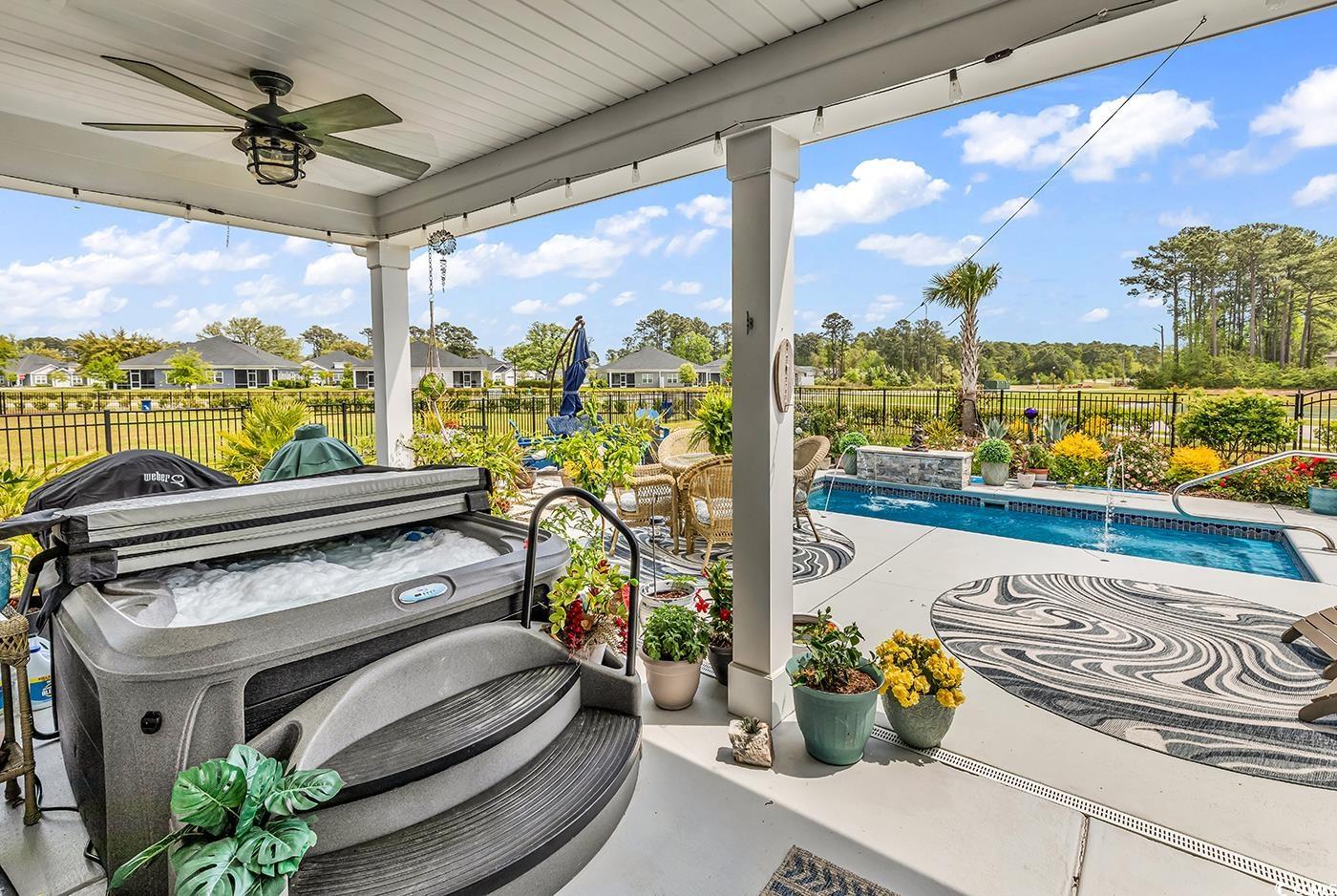 296 Switchgrass Loop Little River, SC 29566 - Photo 27 of 40 View of patio / terrace featuring a fenced in pool