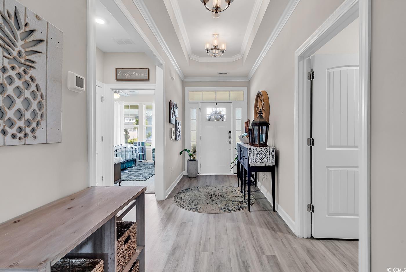 296 Switchgrass Loop Little River, SC 29566 - Photo 3 of 40 Entrance foyer with baseboards, light wood finishe
