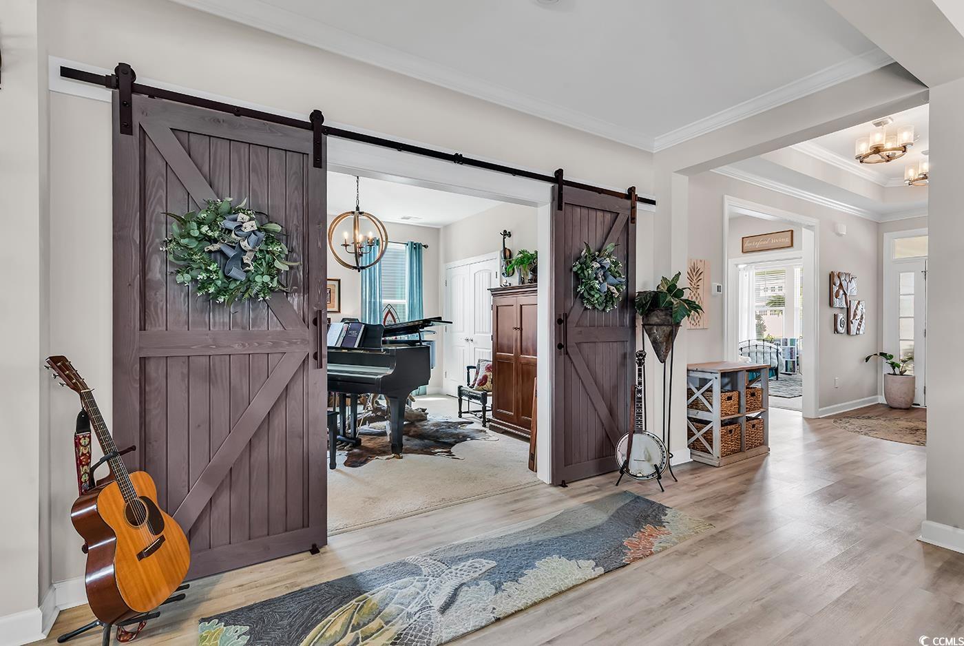 296 Switchgrass Loop Little River, SC 29566 - Photo 6 of 40 Entryway featuring baseboards, an inviting chandel