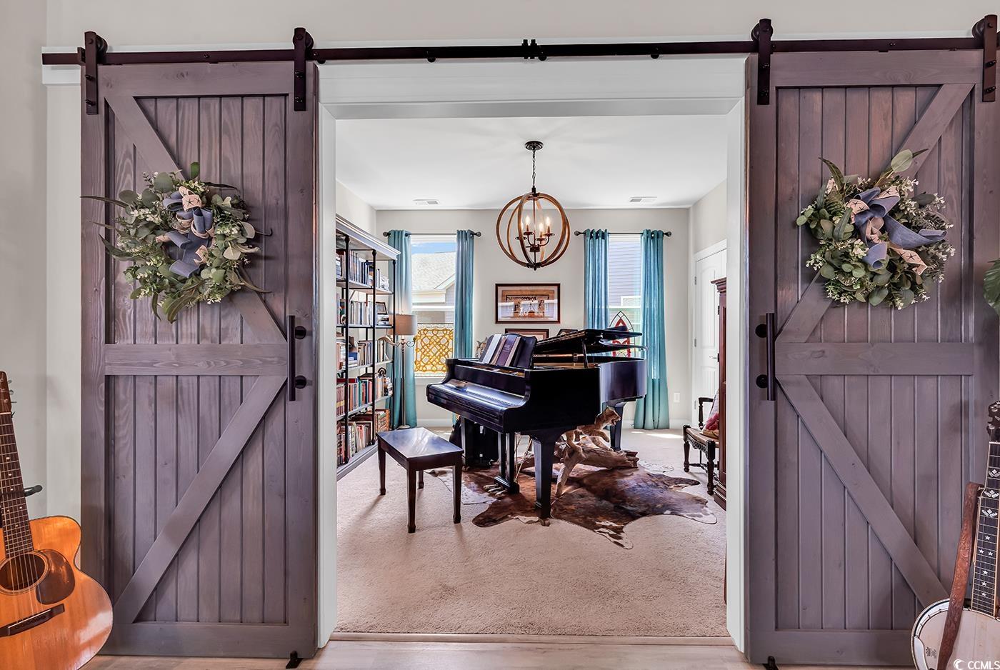 296 Switchgrass Loop Little River, SC 29566 - Photo 7 of 40 Interior space featuring a chandelier, a barn door