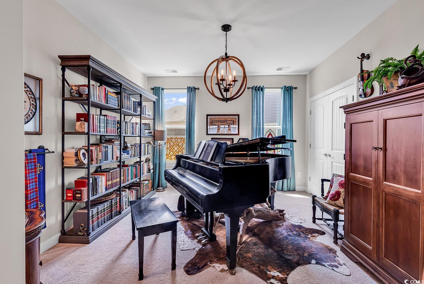 296 Switchgrass Loop Little River, SC 29566 - Photo 8 of 40 Living area with a chandelier, visible vents, base
