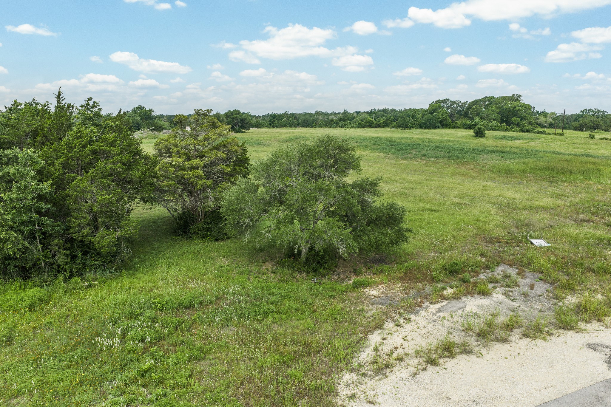 109 Compound Lane Round Top, TX 78954 - Photo 14 of 20 a view of lake with green space