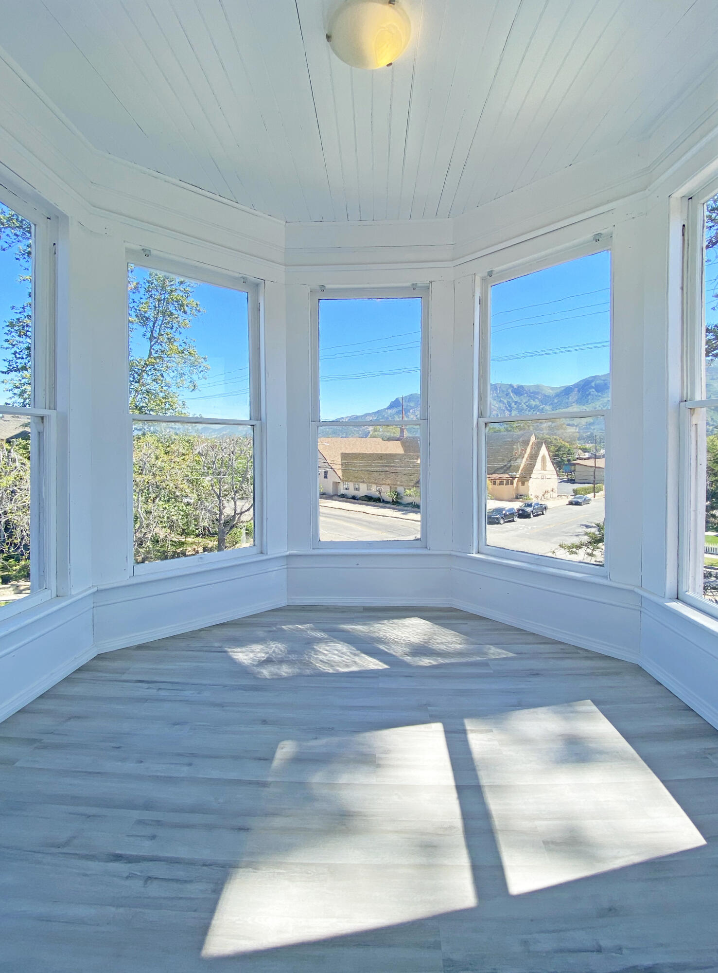 a view of an empty room with windows