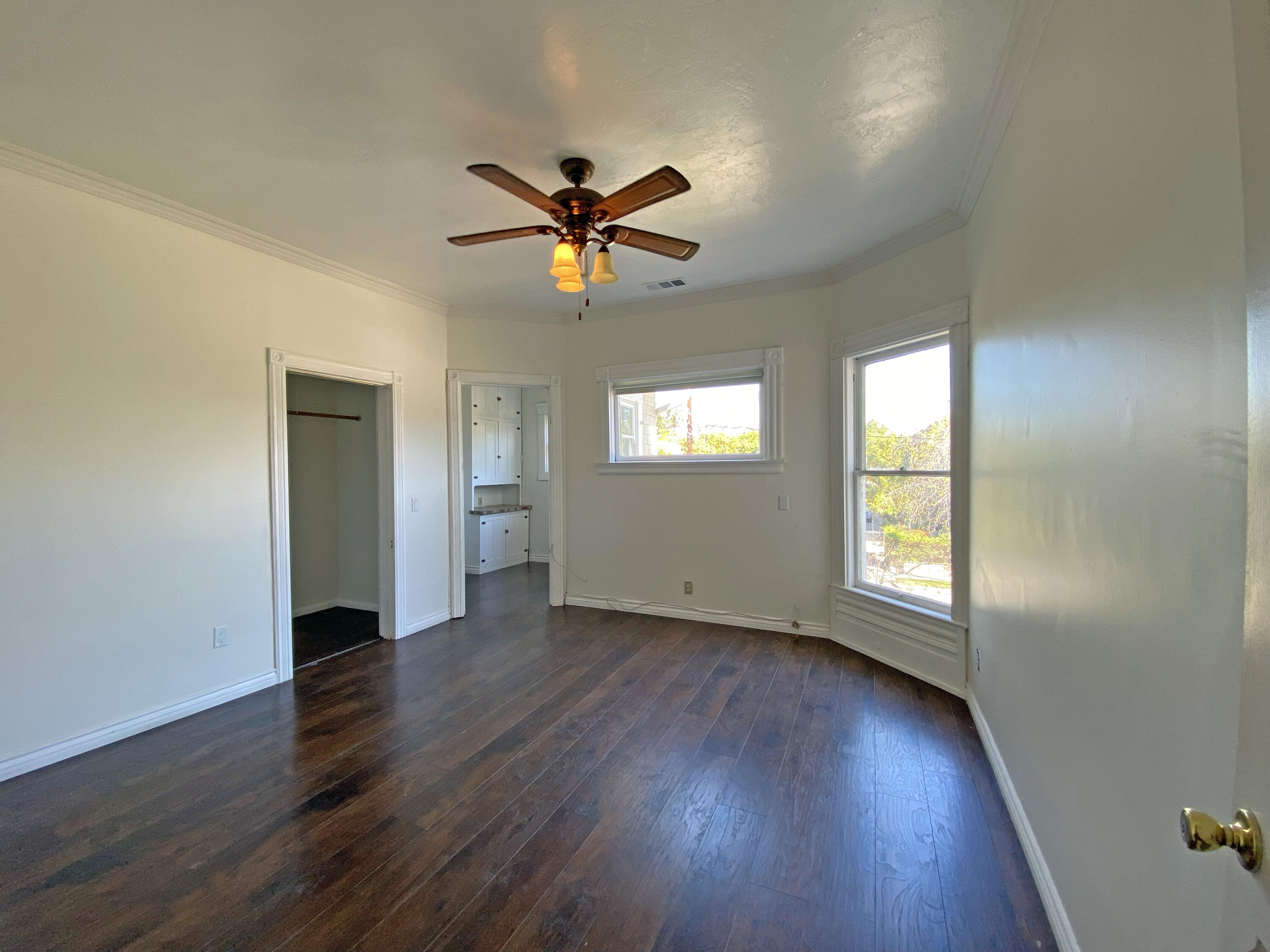 933 East Santa Paula Street, Unit C Santa Paula, CA 93060 - Photo 5 of 6 a view of empty room with wooden floor and fan