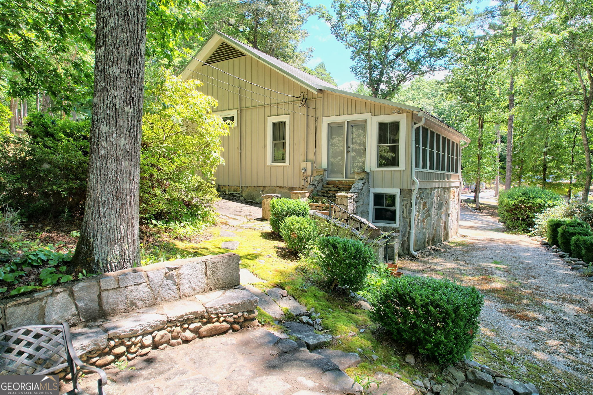 208 Colony Road Dillard, GA 30537 - Photo 14 of 80 a front view of a house with garden