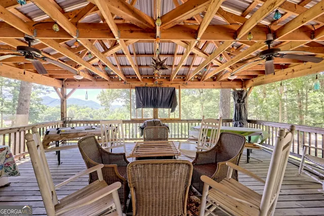 a view of a small house in the middle of a yard