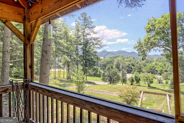 a living room with furniture a fireplace and a table