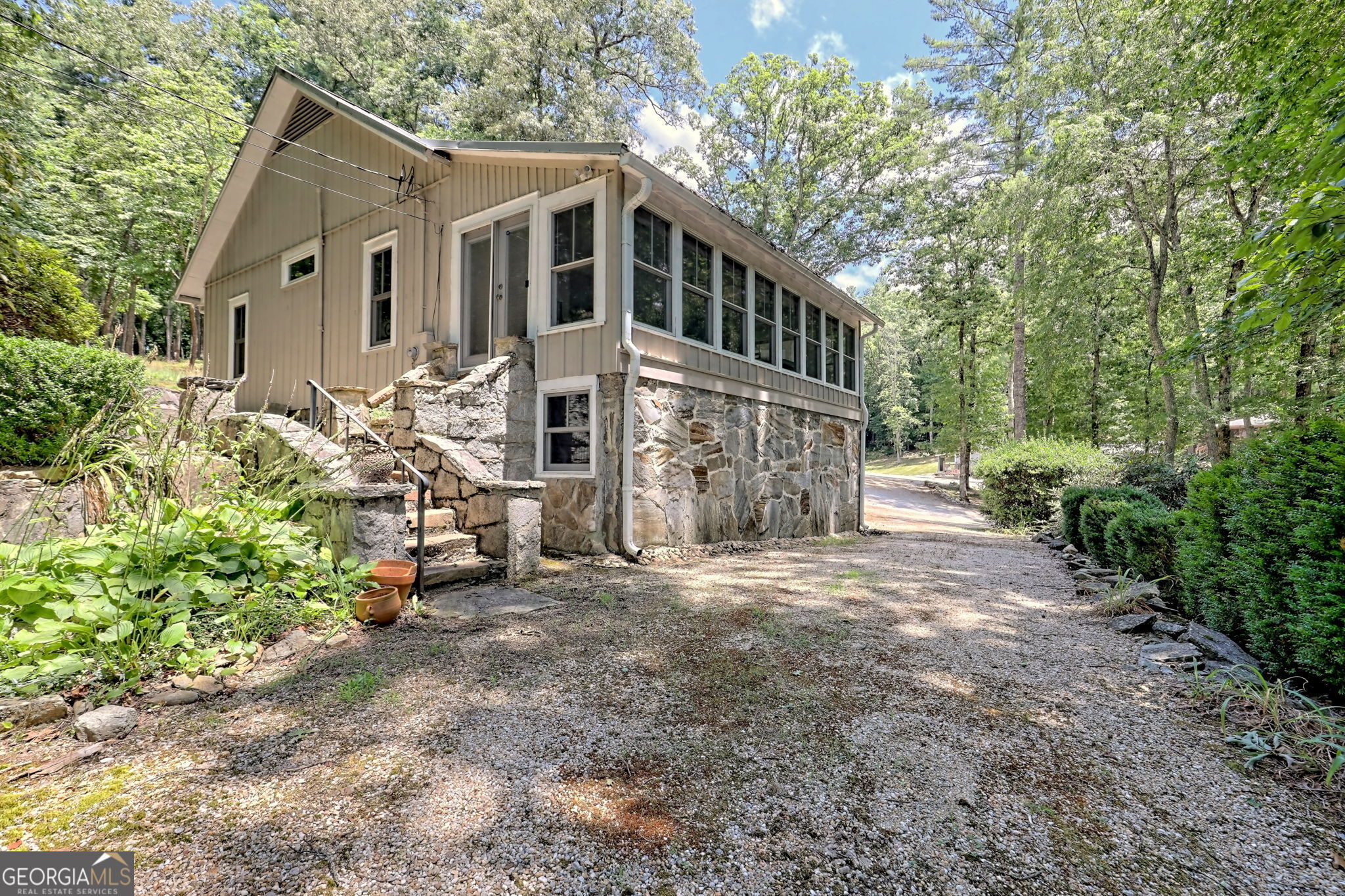 208 Colony Road Dillard, GA 30537 - Photo 2 of 80 a front view of a house with a yard and trees
