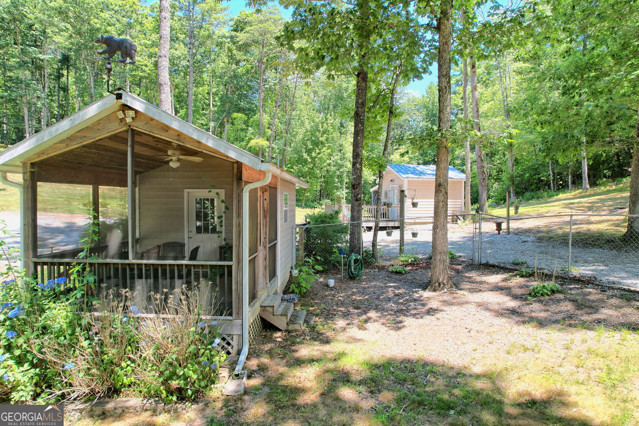 208 Colony Road Dillard, GA 30537 - Photo 27 of 80 a view of a small house in the middle of a yard