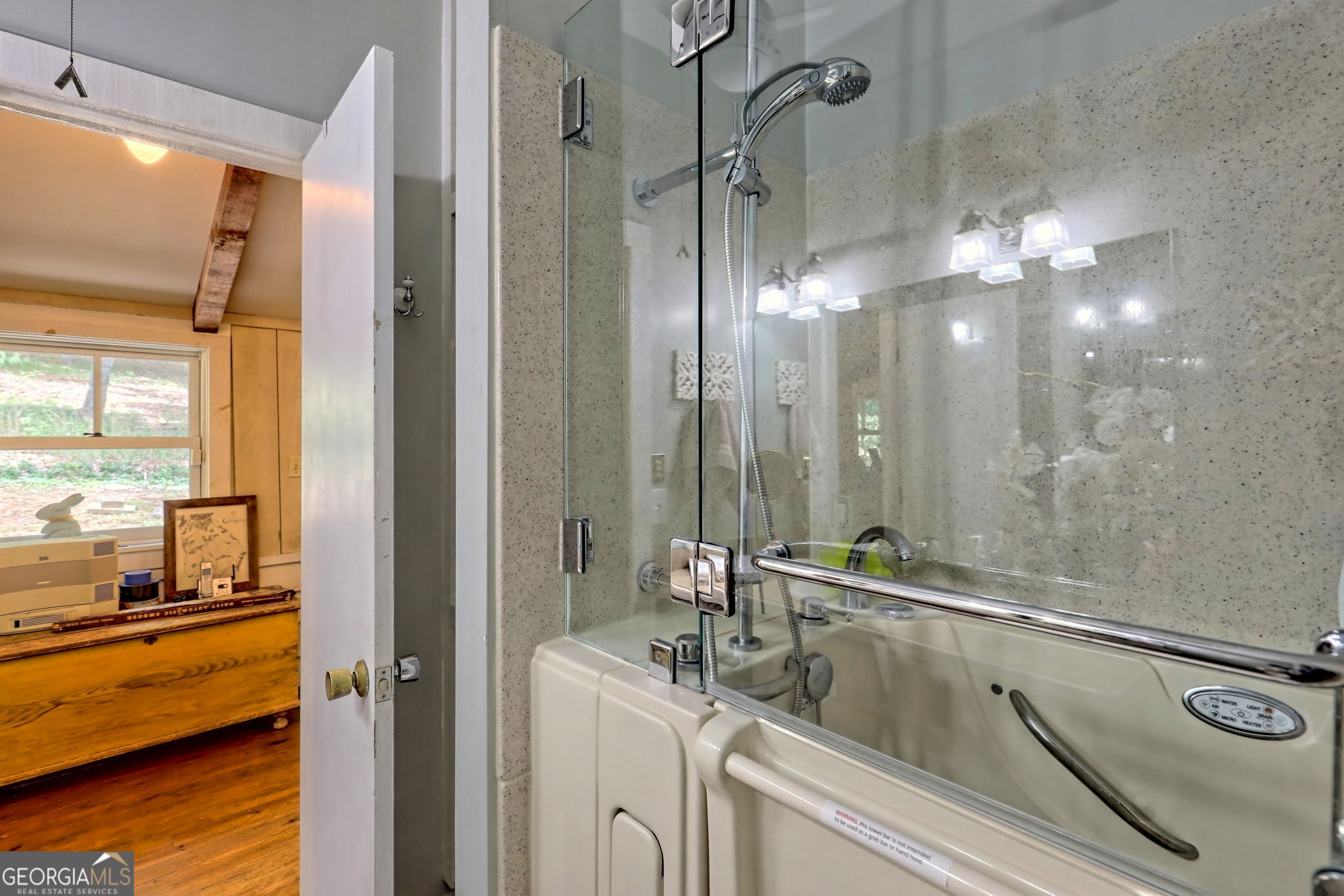208 Colony Road Dillard, GA 30537 - Photo 36 of 80 a bathroom with a sink and a mirror