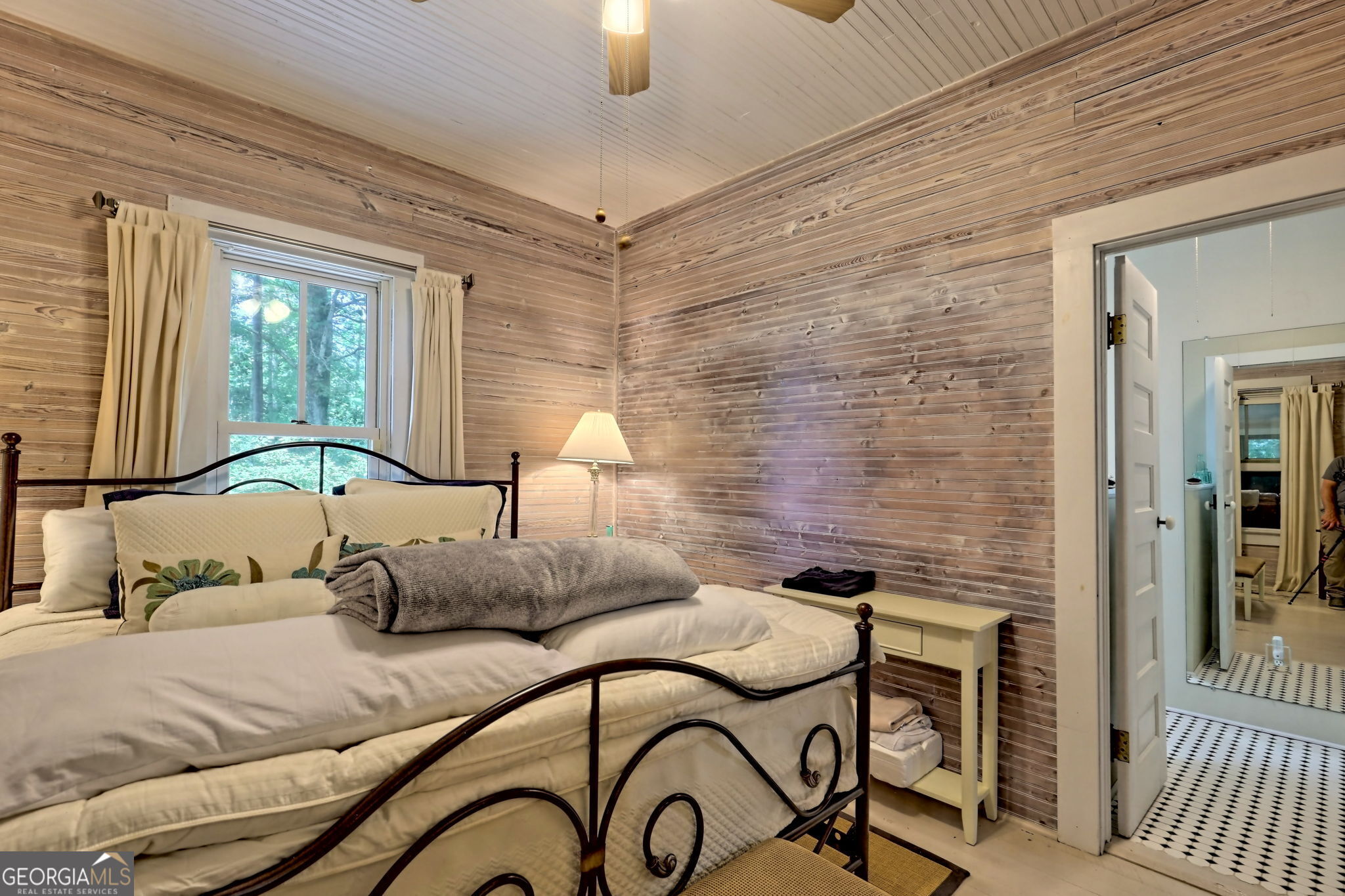 208 Colony Road Dillard, GA 30537 - Photo 45 of 80 a bedroom with a bed and a chandelier