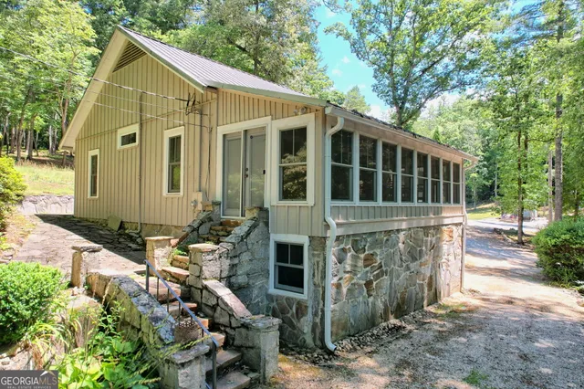 a view of a building with a tree in front